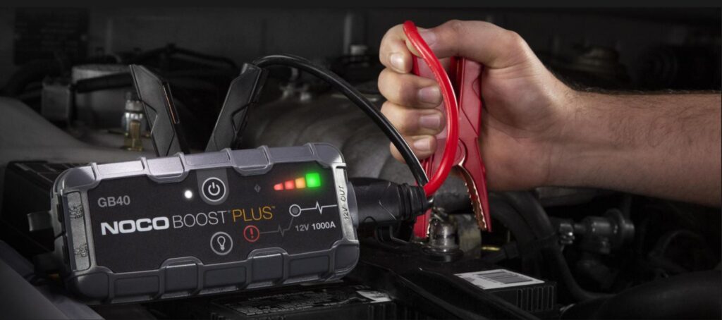 Hand with Vehicle Jump Starter