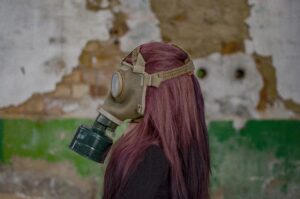 Little girl in gas mask